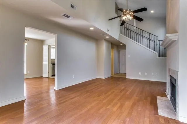 wooden floor in an empty room with a fireplace
