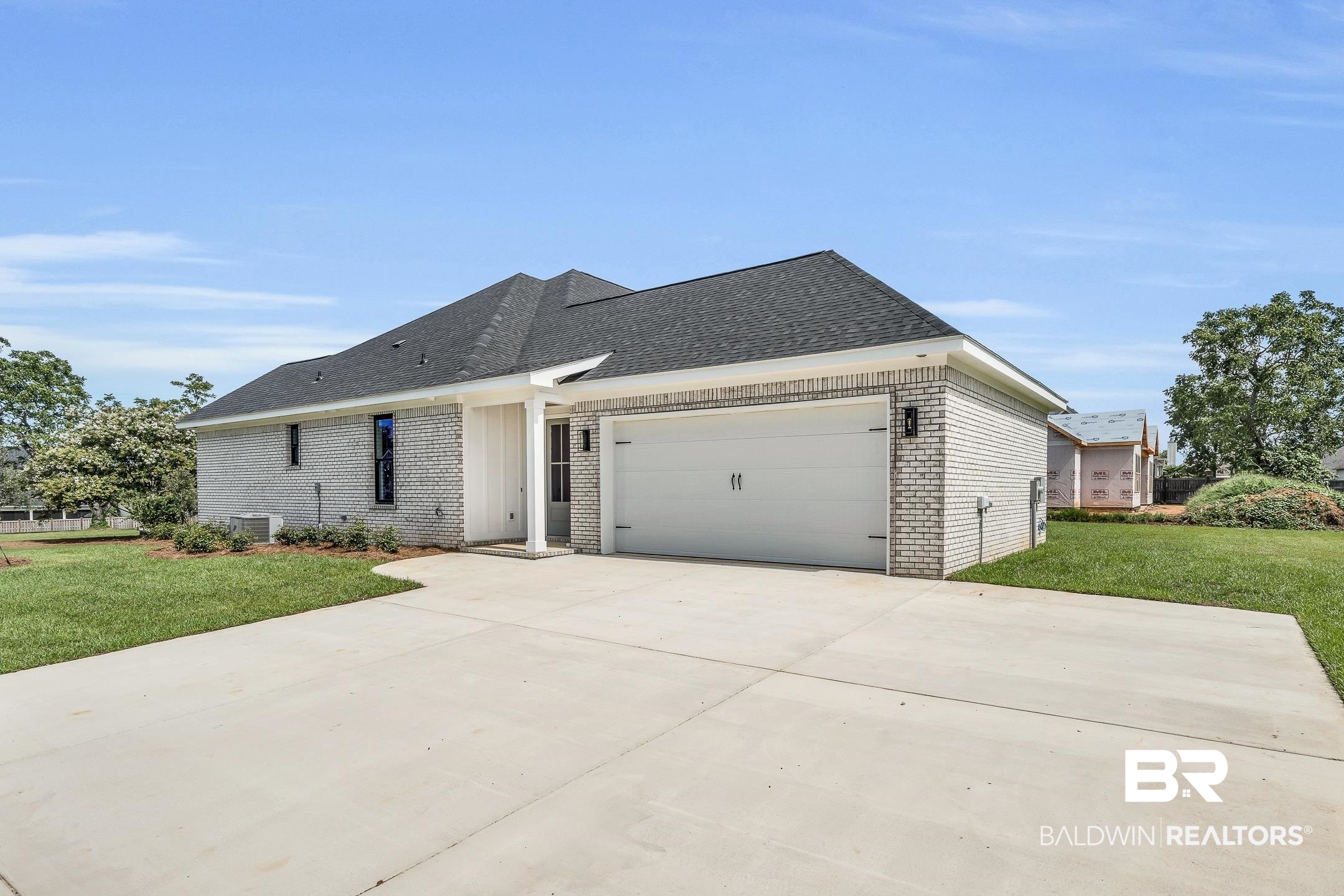 17786 Burwick Loop Fairhope, AL 36532 - Photo 4 of 57 View of front of house featuring central air condition unit, a garage, and a front yard