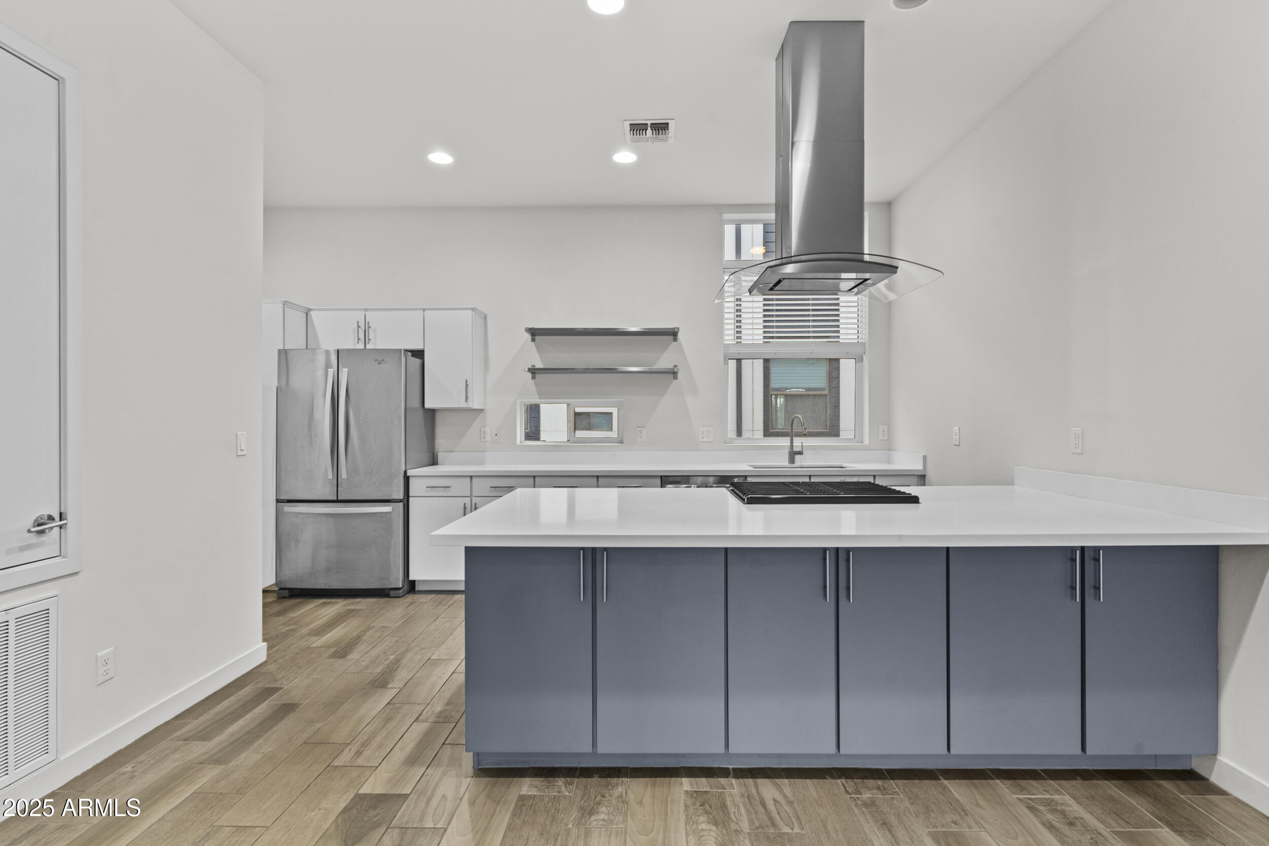 325 East Coronado Road, Unit 8 Phoenix, AZ 85004 - Photo 11 of 34 a kitchen with stainless steel appliances a sink and a refrigerator