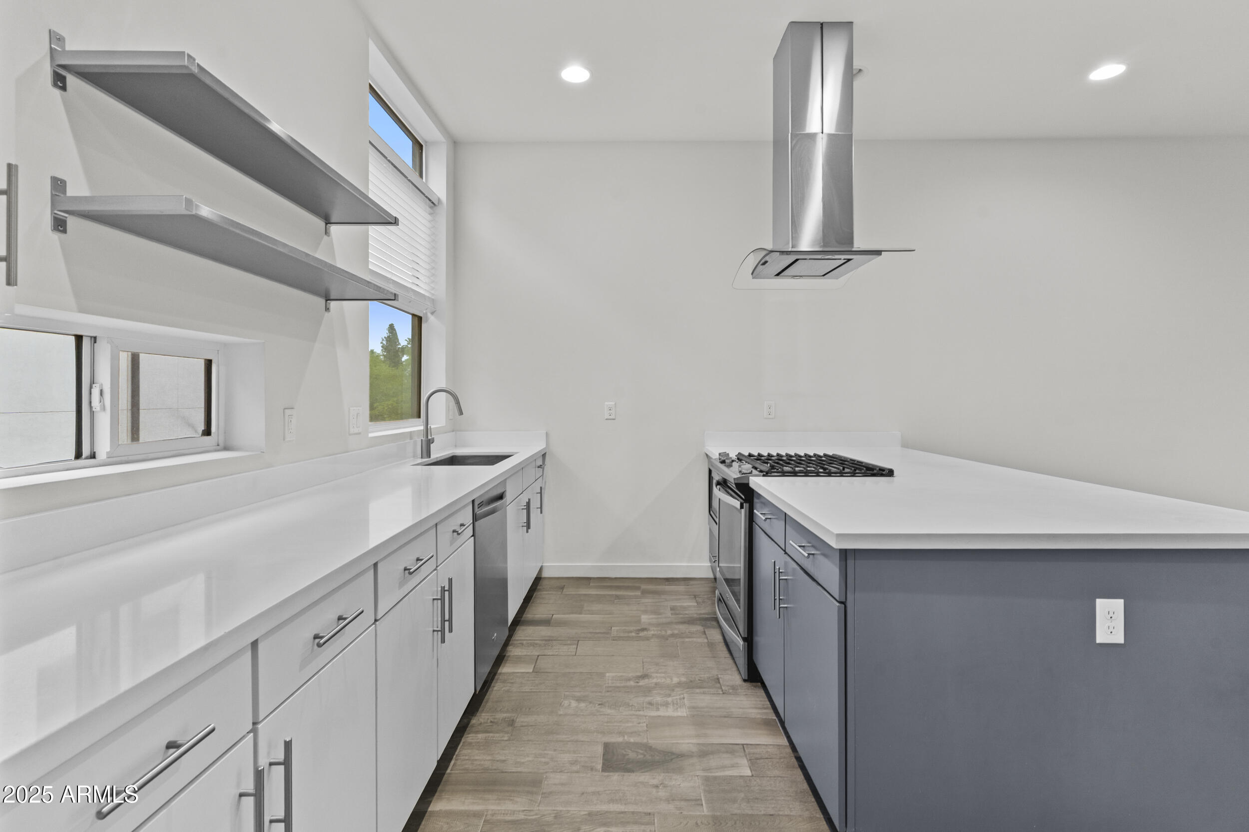325 East Coronado Road, Unit 8 Phoenix, AZ 85004 - Photo 12 of 34 a kitchen with a sink and wooden floor