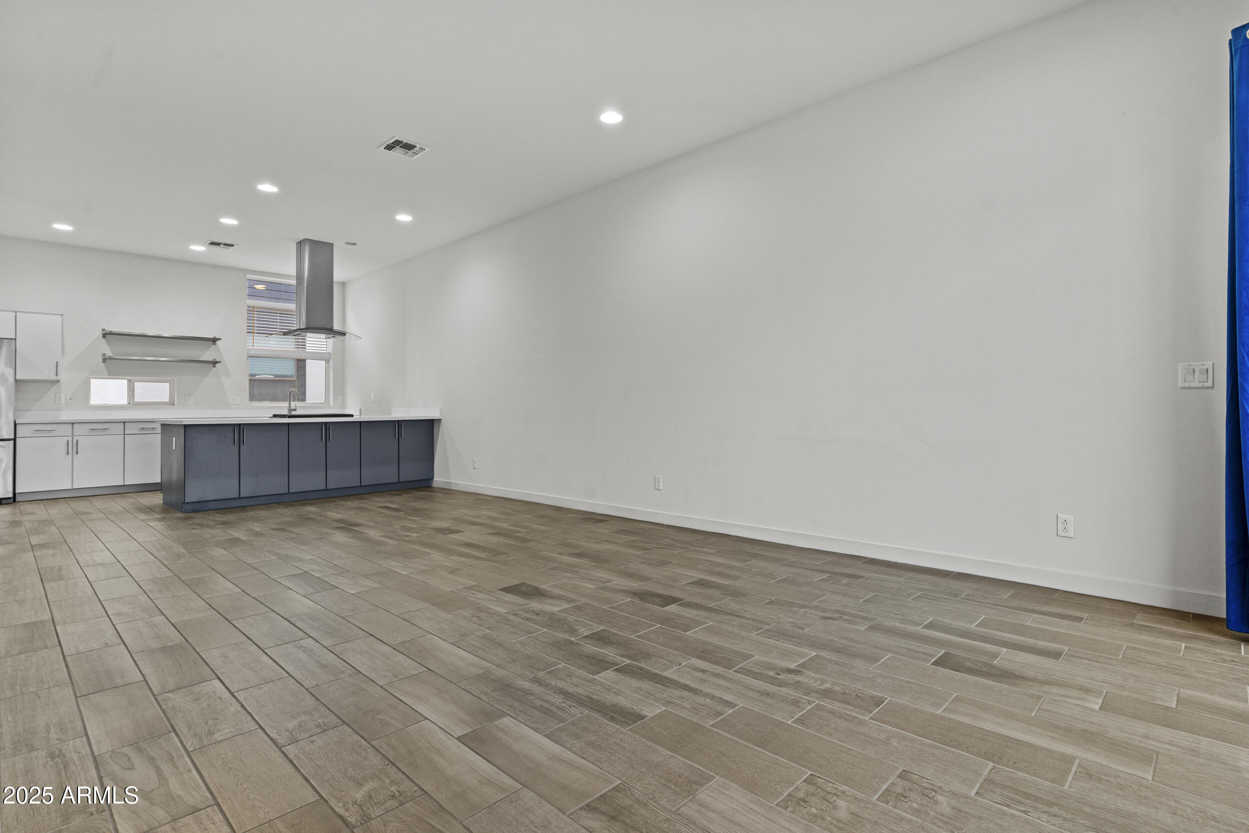 325 East Coronado Road, Unit 8 Phoenix, AZ 85004 - Photo 14 of 34 a view of kitchen and hall with wooden floor