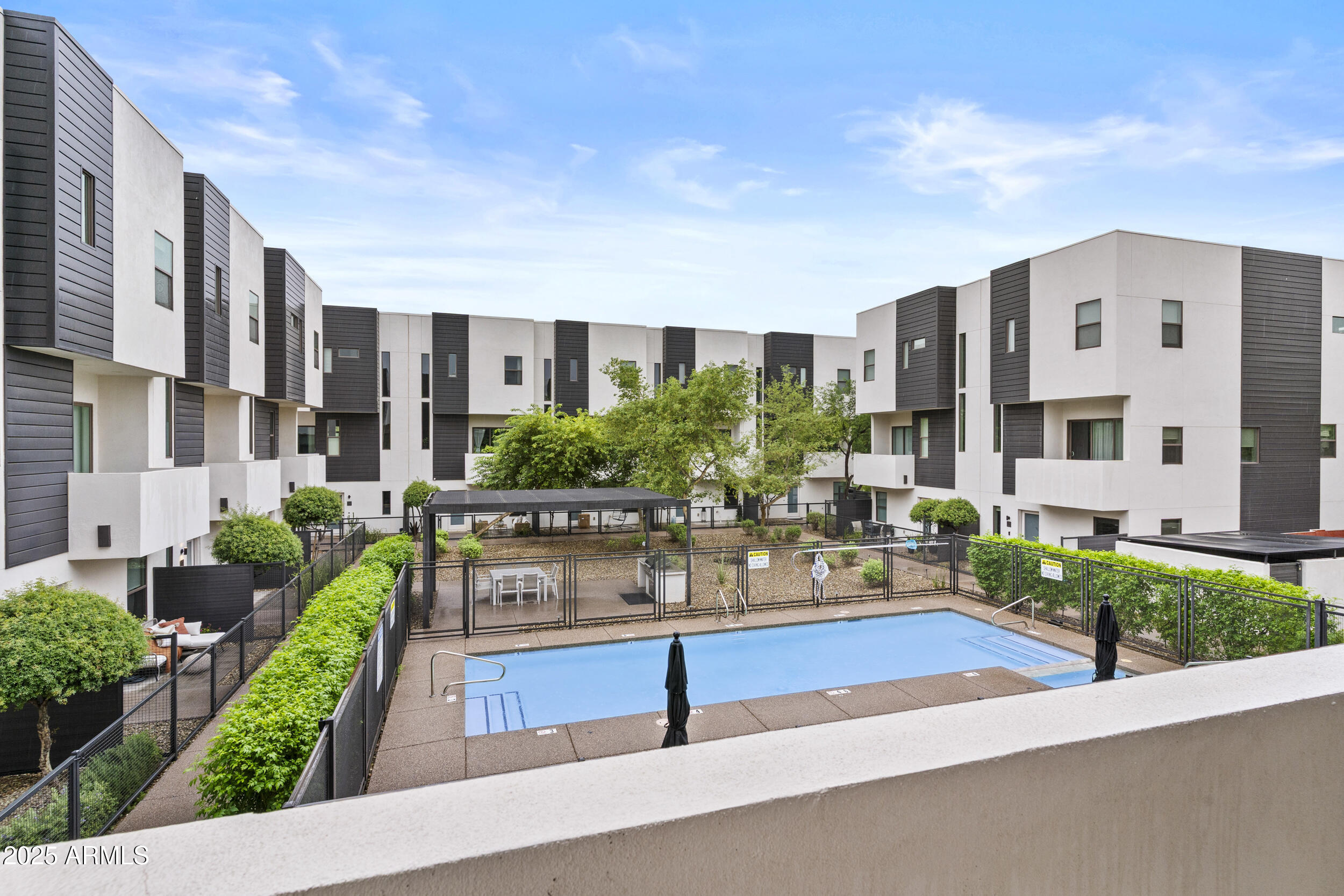 325 East Coronado Road, Unit 8 Phoenix, AZ 85004 - Photo 17 of 34 a view of building with potted plant and large windows