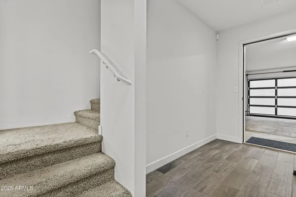 a view of a room with a white walls