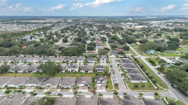 an aerial view of residential houses with outdoor space