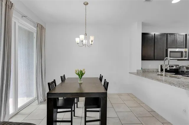 a kitchen with a table and chairs in it