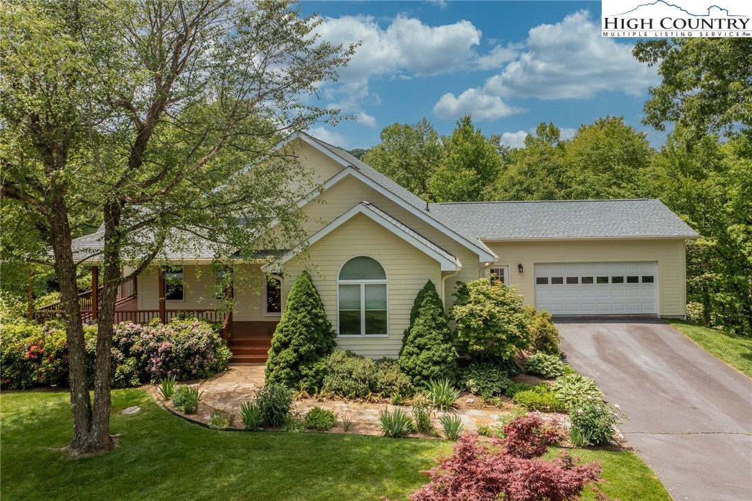 517 Willow Trail Boone, NC 28607 - Photo 19 of 26 a front view of a house with garden