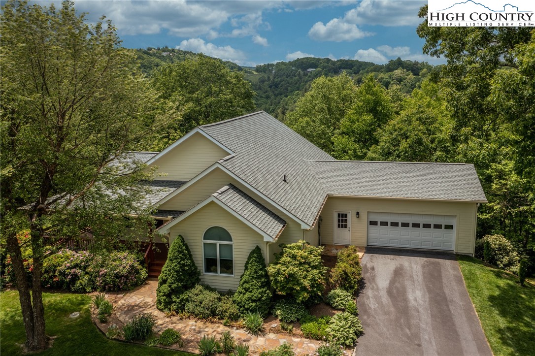 517 Willow Trail Boone, NC 28607 - Photo 21 of 26 a view of a house with a yard and potted plants