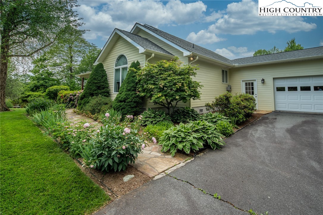 517 Willow Trail Boone, NC 28607 - Photo 22 of 26 a front view of a house with a yard