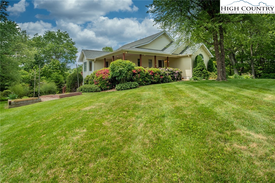 517 Willow Trail Boone, NC 28607 - Photo 25 of 26 a front view of a house with a yard