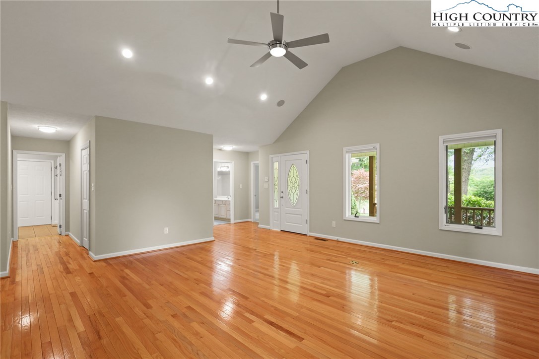 517 Willow Trail Boone, NC 28607 - Photo 7 of 26 a view of an empty room with window and wooden floor