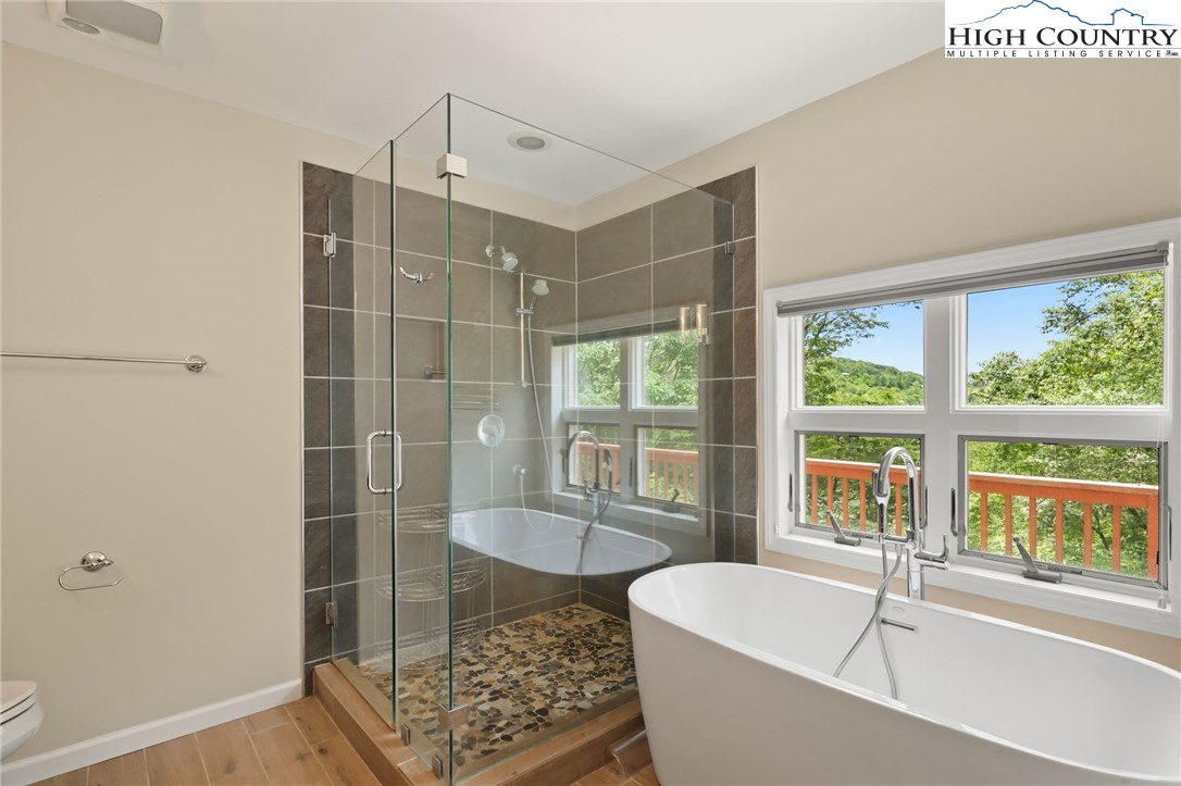 517 Willow Trail Boone, NC 28607 - Photo 10 of 26 a bathroom with a tub and shower