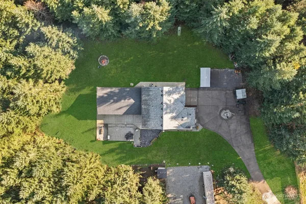 an aerial view of a house with a garden