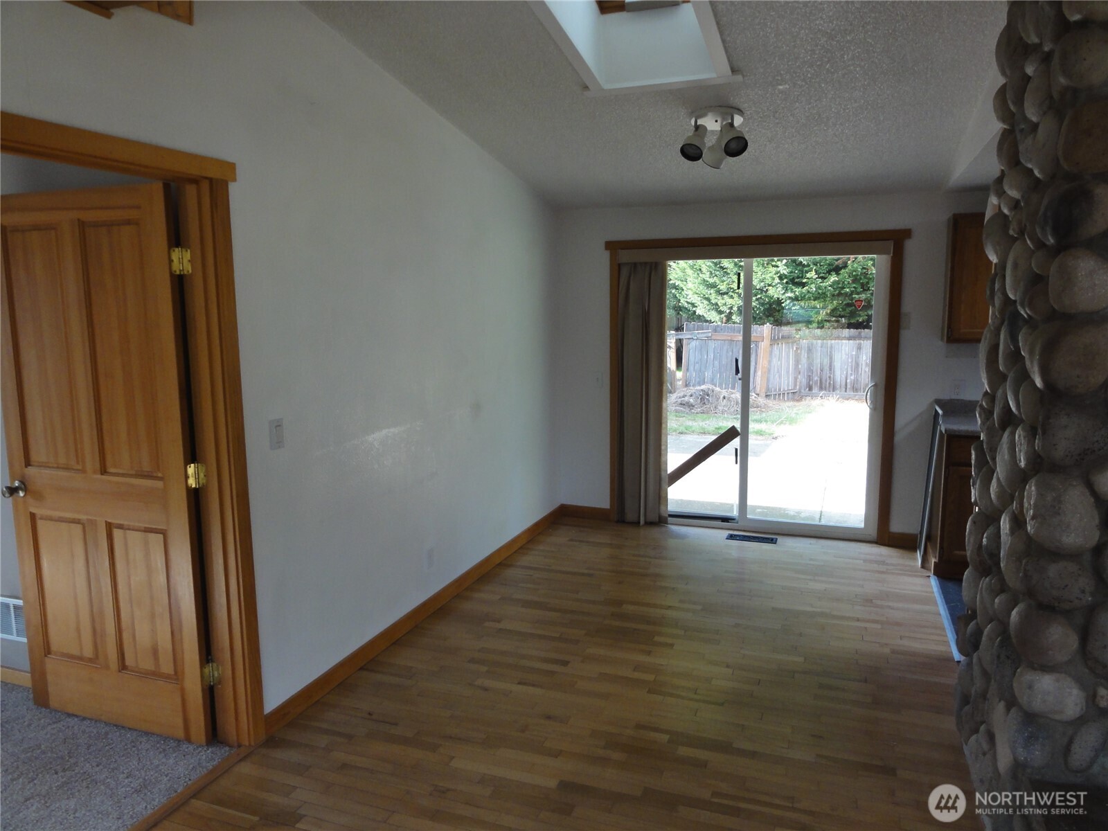 28821 18th Avenue South Federal Way, WA 98003 - Photo 3 of 14 an empty room with wooden floor and a window