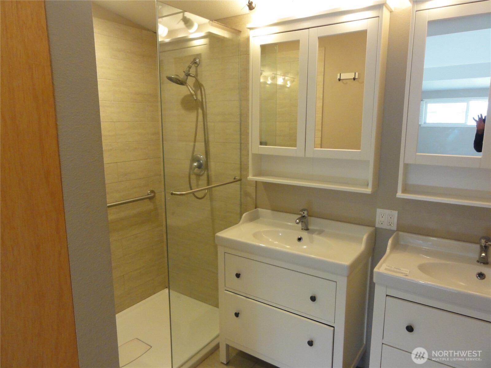 28821 18th Avenue South Federal Way, WA 98003 - Photo 6 of 14 a bathroom with a shower a sink and a mirror