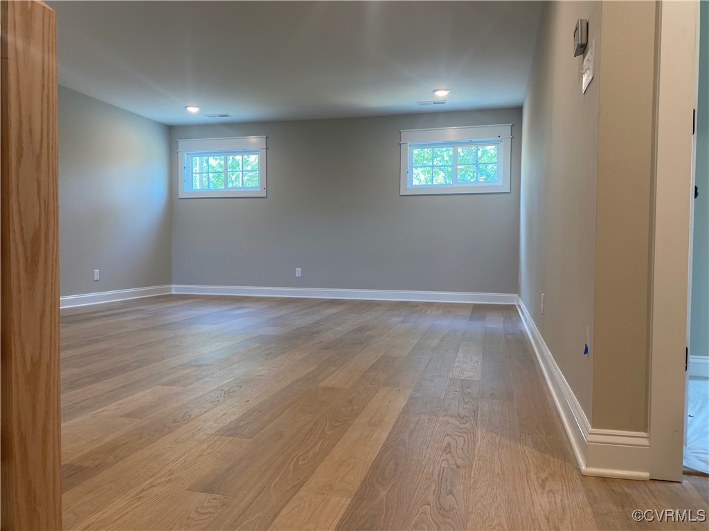 2263 Osborne Rdg Road Rockville, VA 23146 - Photo 15 of 22 an empty room with wooden floor and windows