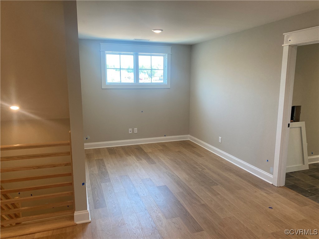 2263 Osborne Rdg Road Rockville, VA 23146 - Photo 18 of 22 an empty room with wooden floor and windows