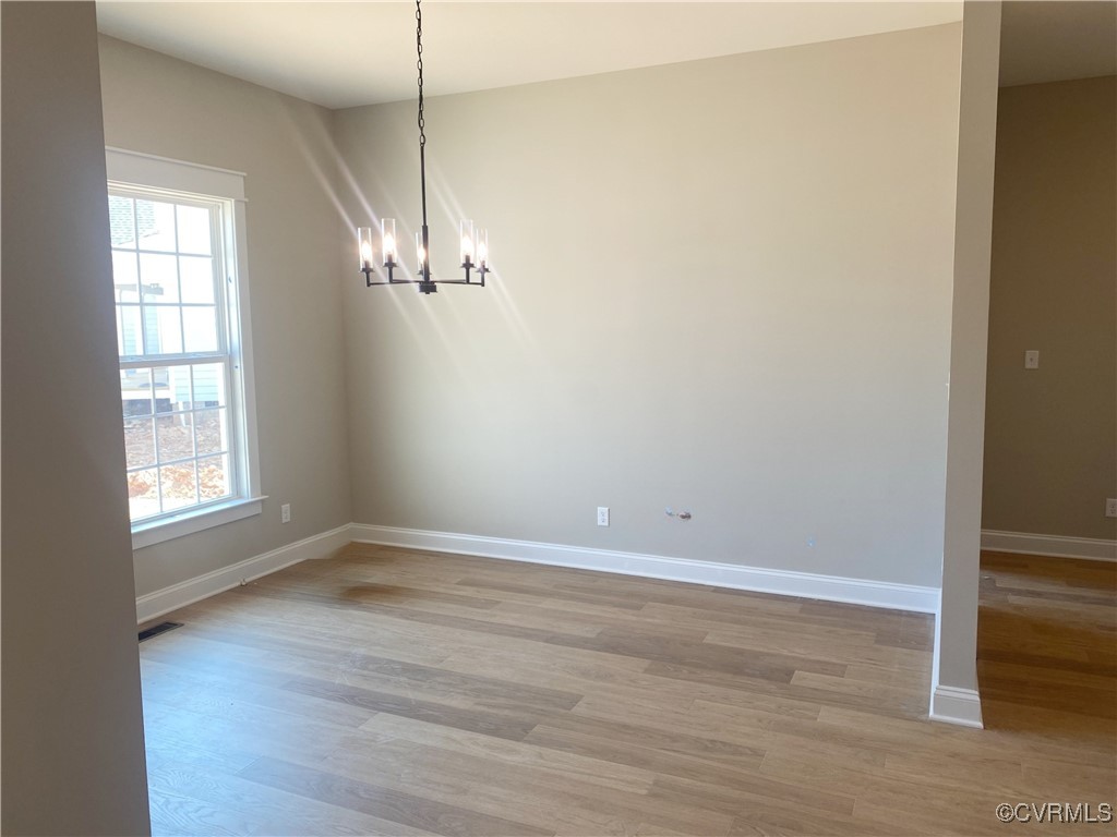 2263 Osborne Rdg Road Rockville, VA 23146 - Photo 4 of 22 a view of a room with wooden floor and chandelier