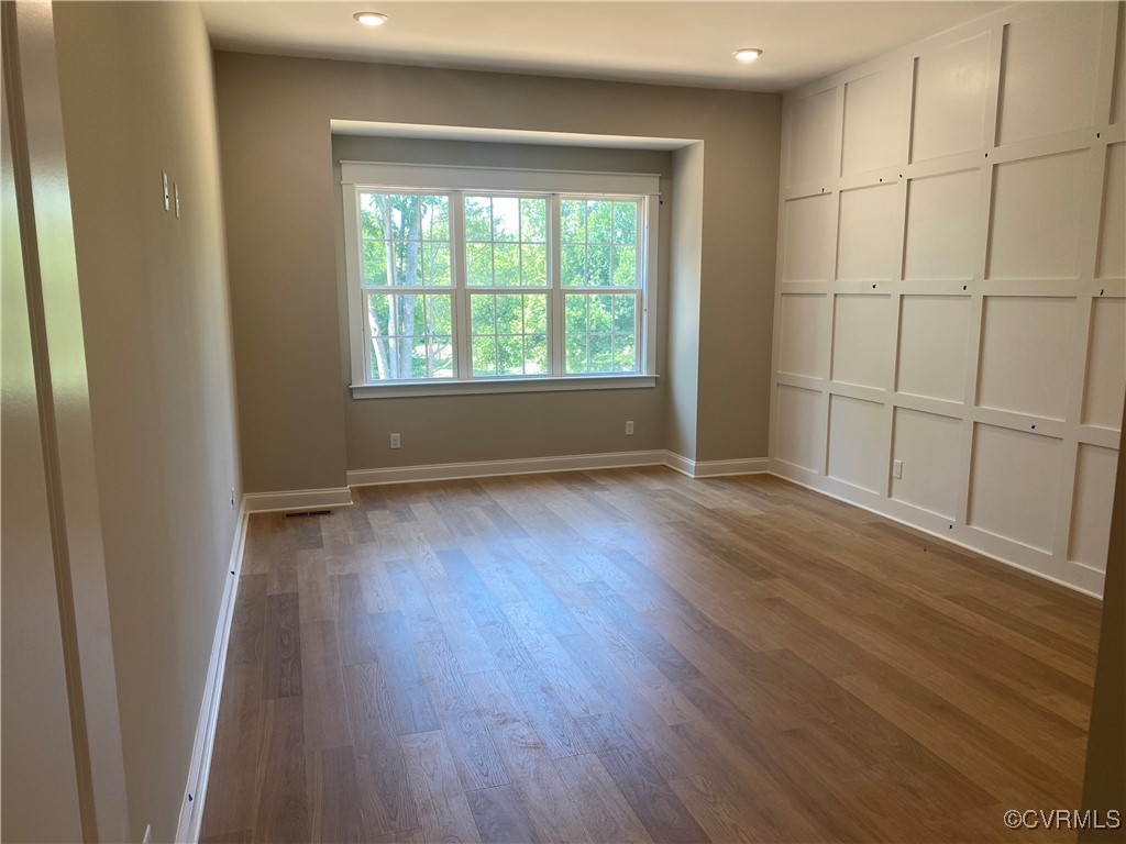 2263 Osborne Rdg Road Rockville, VA 23146 - Photo 10 of 22 an empty room with wooden floor and windows