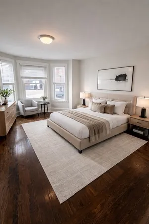 a spacious bedroom with a bed and windows