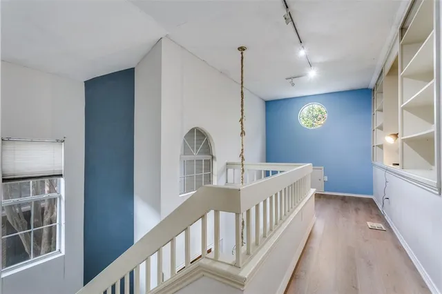 a view of an entryway with wooden floor