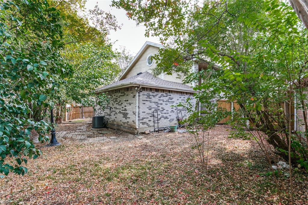 9416 Penny Lane Irving, TX 75063 - Photo 21 of 21 a view of a house with a yard and tree
