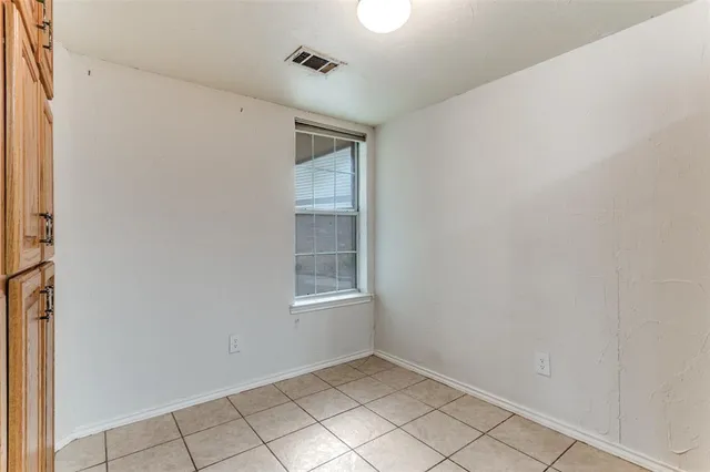 a view of an empty room with windows