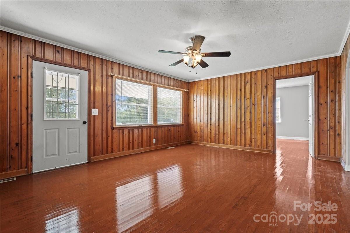 5155 Percy Lane Wallace, SC 29596 - Photo 11 of 33 a view of an empty room with a window and wooden floor