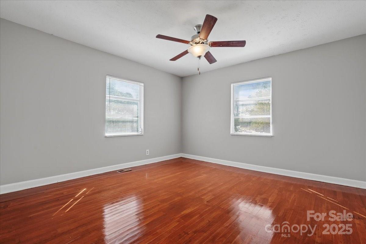5155 Percy Lane Wallace, SC 29596 - Photo 16 of 33 a view of a big room with wooden floor and windows