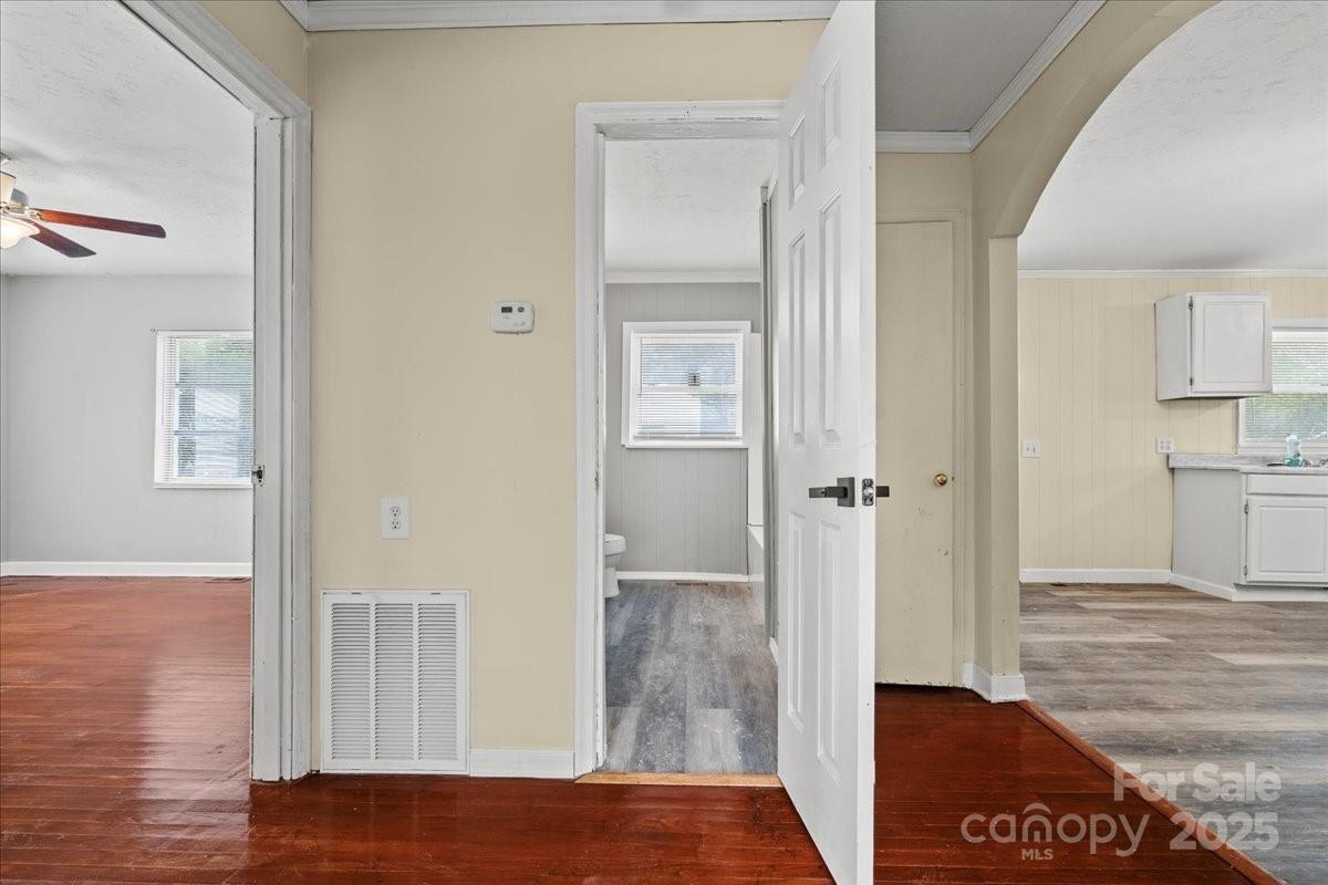 5155 Percy Lane Wallace, SC 29596 - Photo 18 of 33 a view of a hallway with wooden floor and cabinet