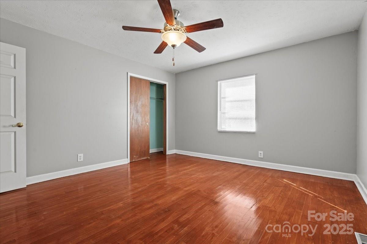 5155 Percy Lane Wallace, SC 29596 - Photo 20 of 33 wooden floor in an empty room with a window