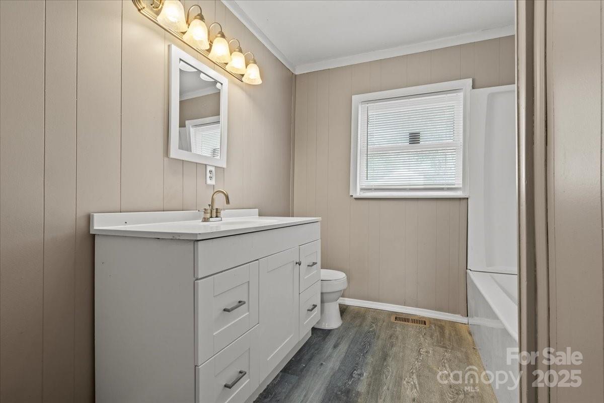 5155 Percy Lane Wallace, SC 29596 - Photo 21 of 33 a bathroom with a sink a toilet and a mirror