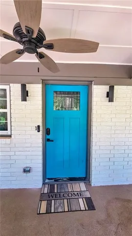 a view of a door with a potted plant