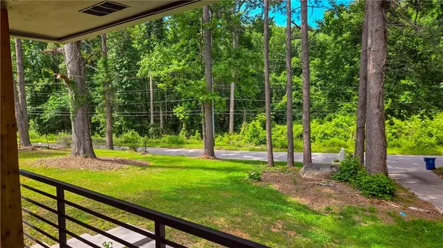 a view of a yard with a tree