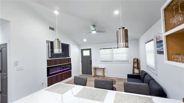 a kitchen with stainless steel appliances kitchen island sink refrigerator and stove