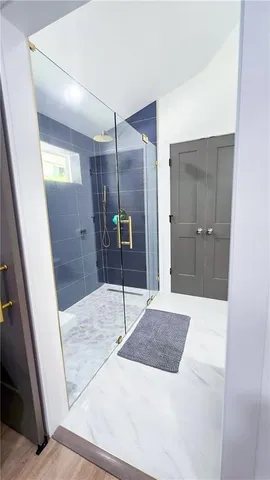 a bathroom with a sink and shower