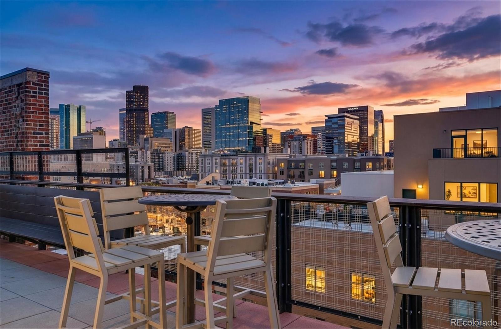 2261 Blake Street, Unit 4F Denver, CO 80205 - Photo 26 of 38 a view of a chairs and table in a terrace