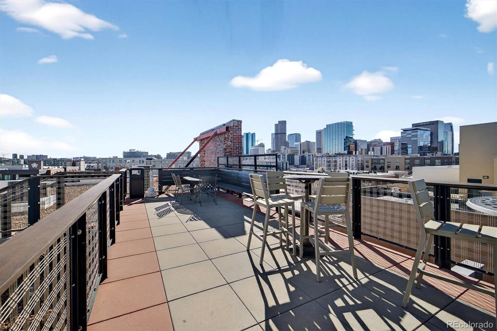 2261 Blake Street, Unit 4F Denver, CO 80205 - Photo 28 of 38 a view of a terrace with seating area