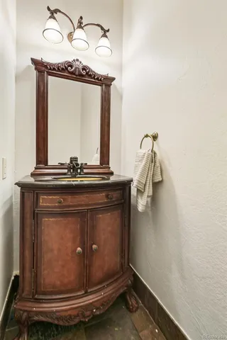 a room with a mirror and a wooden floor