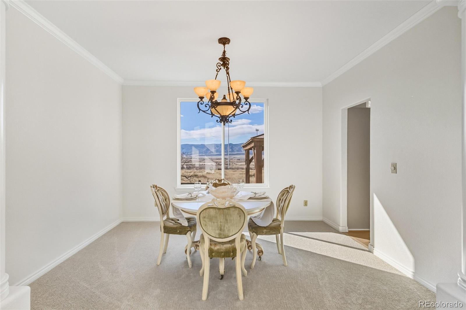 10275 Baneberry Place Highlands Ranch, CO 80129 - Photo 19 of 50 a view of a dining room with furniture and window