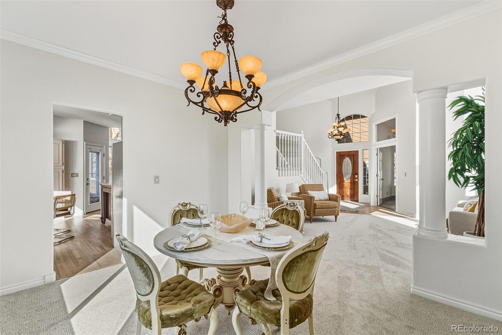 10275 Baneberry Place Highlands Ranch, CO 80129 - Photo 20 of 50 a view of a dining room furniture and chandelier