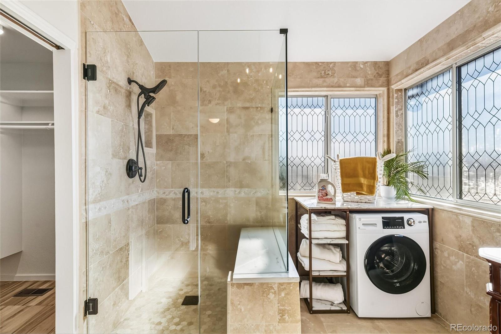10275 Baneberry Place Highlands Ranch, CO 80129 - Photo 27 of 50 a bathroom with a sink a window and a shower
