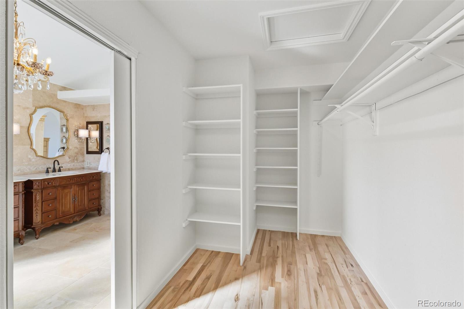 10275 Baneberry Place Highlands Ranch, CO 80129 - Photo 28 of 50 a view of walk in closet with empty racks