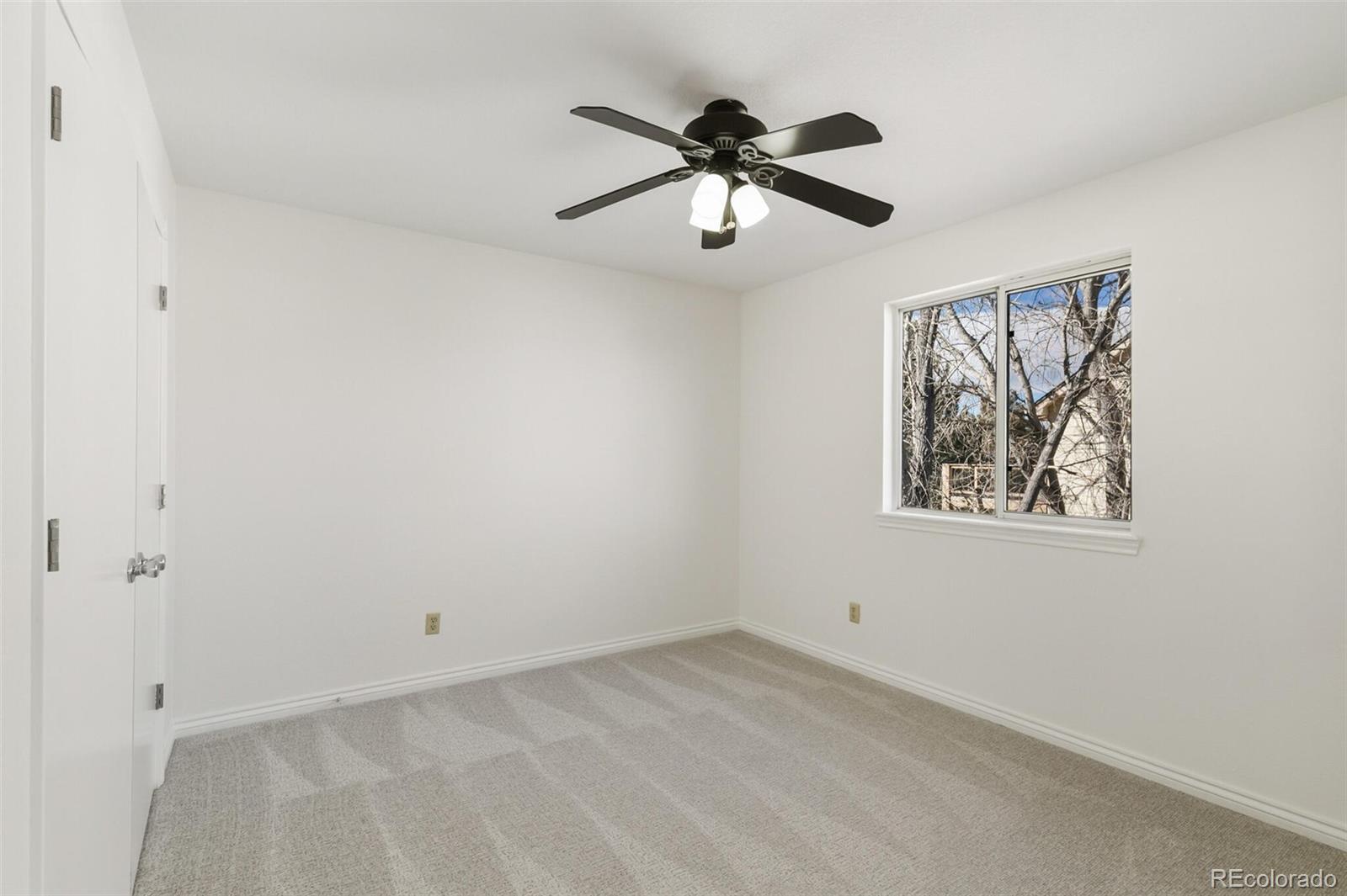 10275 Baneberry Place Highlands Ranch, CO 80129 - Photo 29 of 50 a view of a hallway with a window