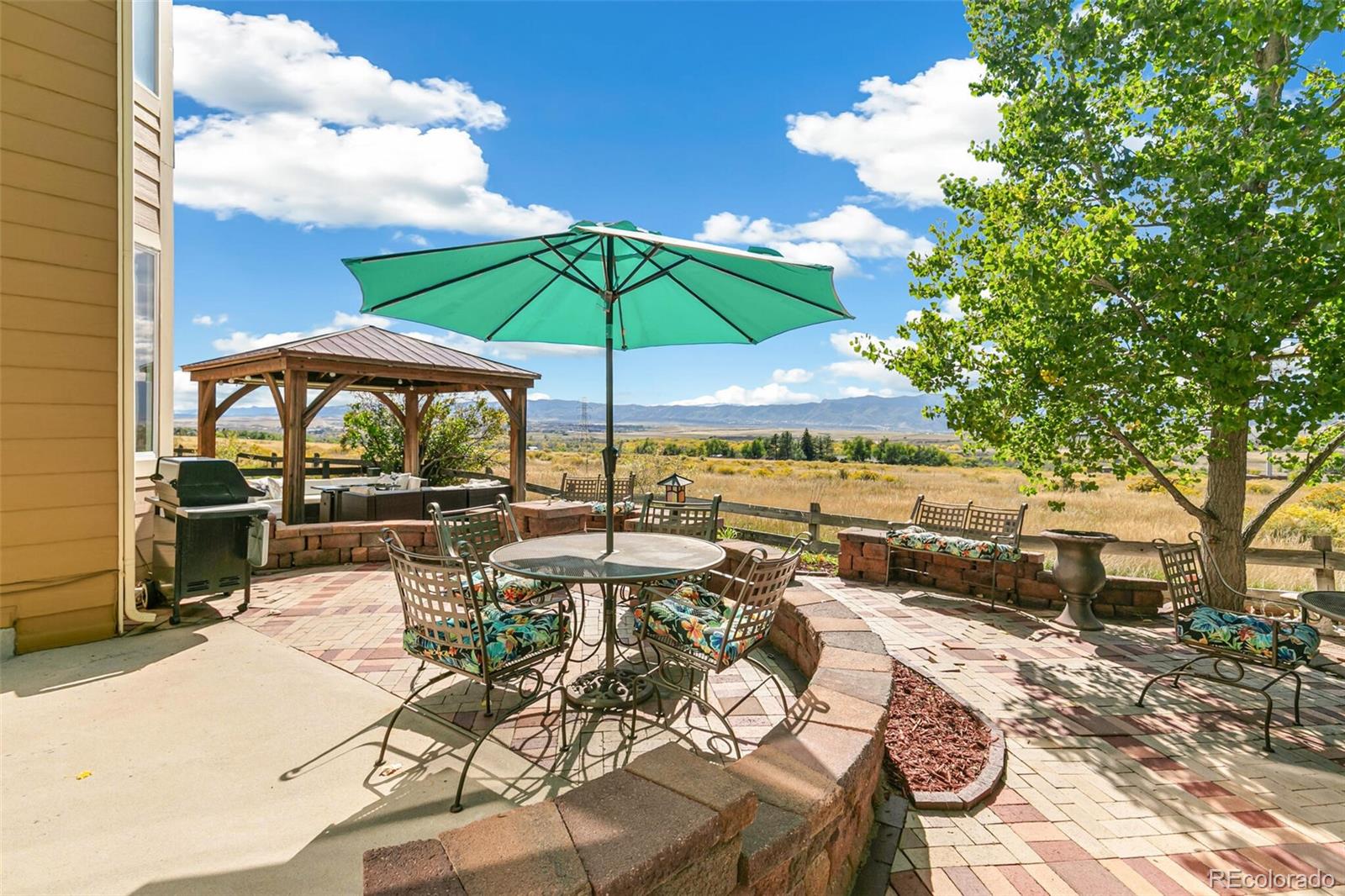 10275 Baneberry Place Highlands Ranch, CO 80129 - Photo 34 of 50 a view of a backyard with sitting area