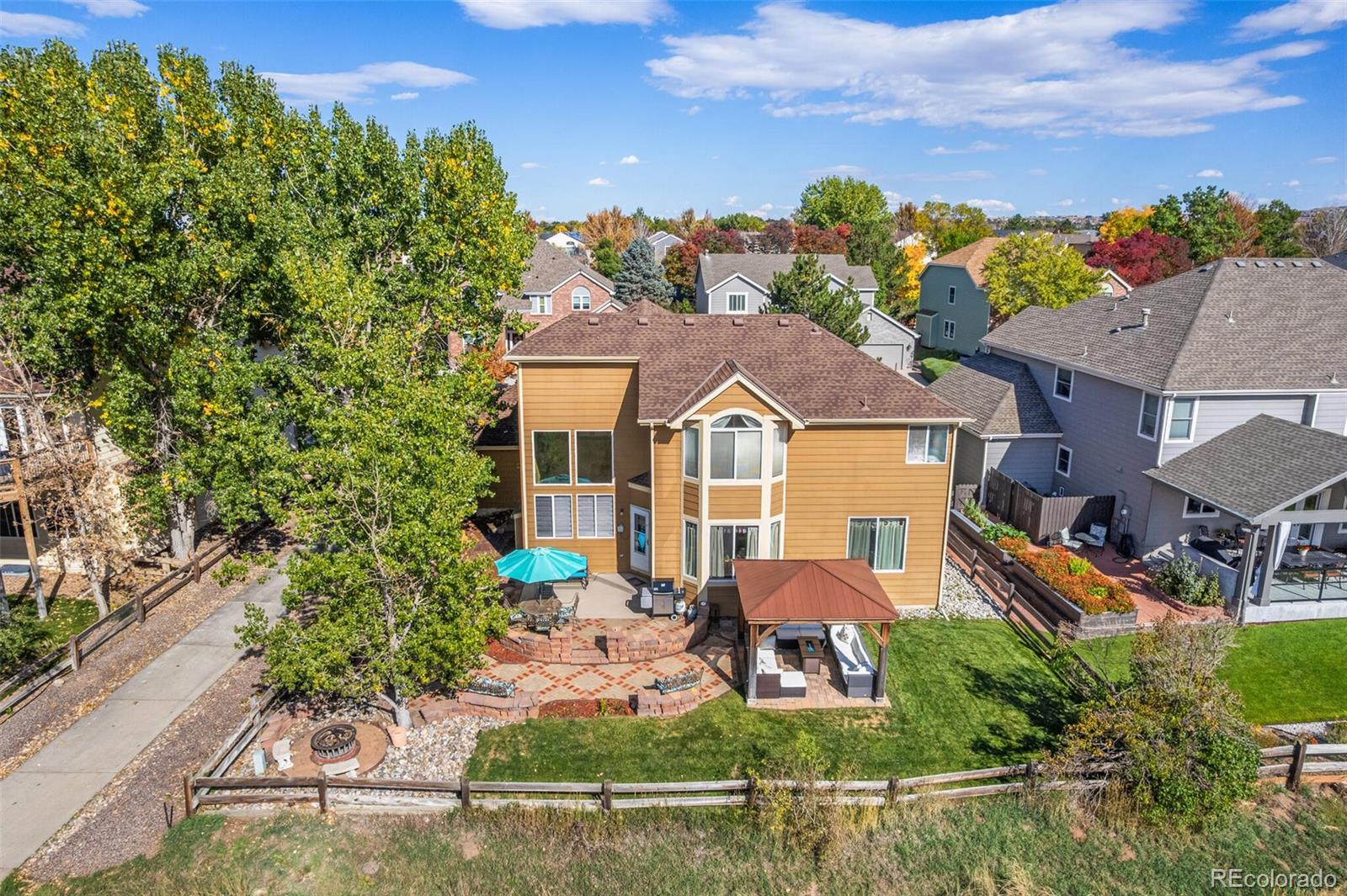 10275 Baneberry Place Highlands Ranch, CO 80129 - Photo 43 of 50 an aerial view of a house with a yard basket ball court and a fountain