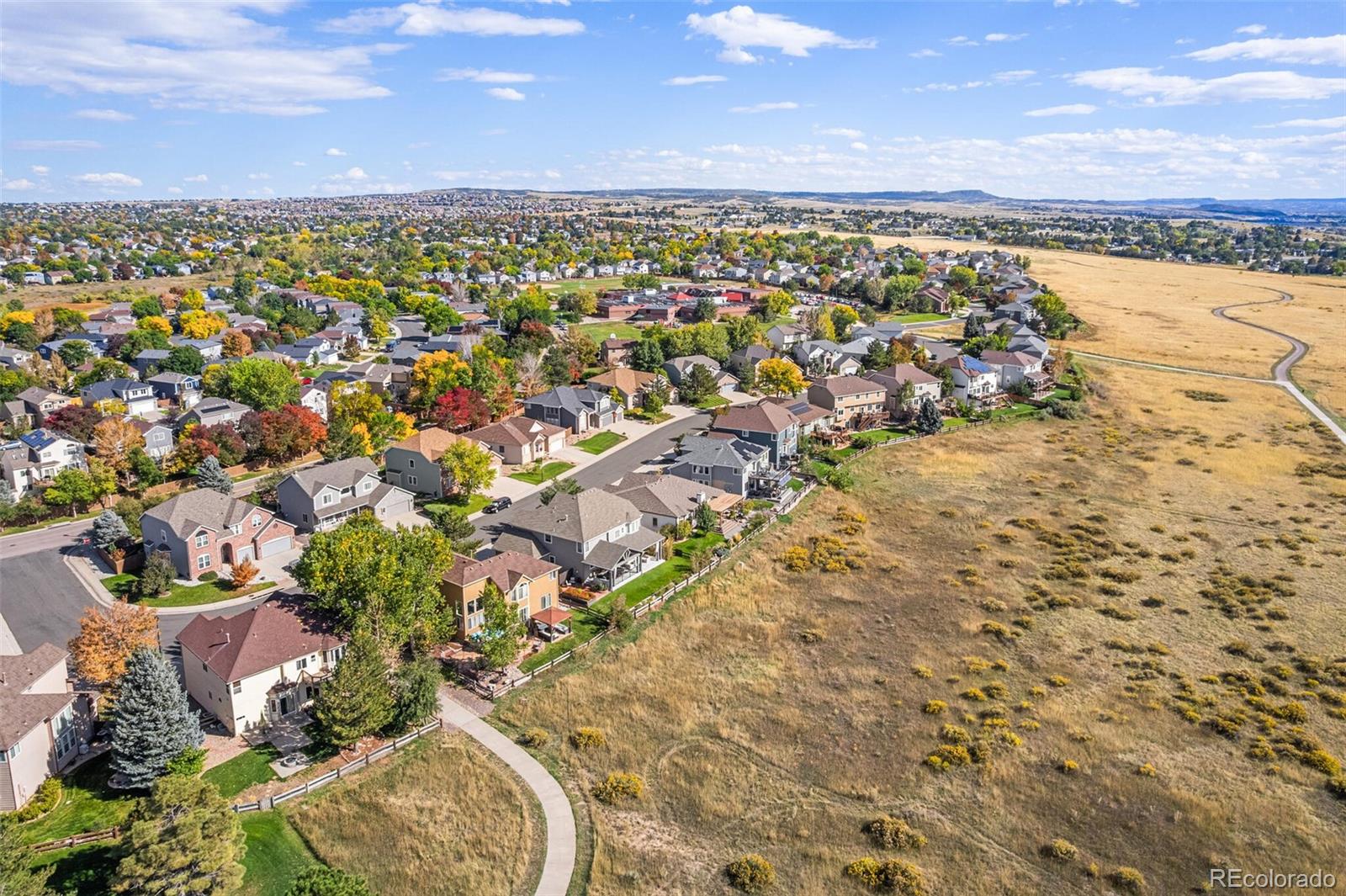 10275 Baneberry Place Highlands Ranch, CO 80129 - Photo 46 of 50 an aerial view of residential building with parking space