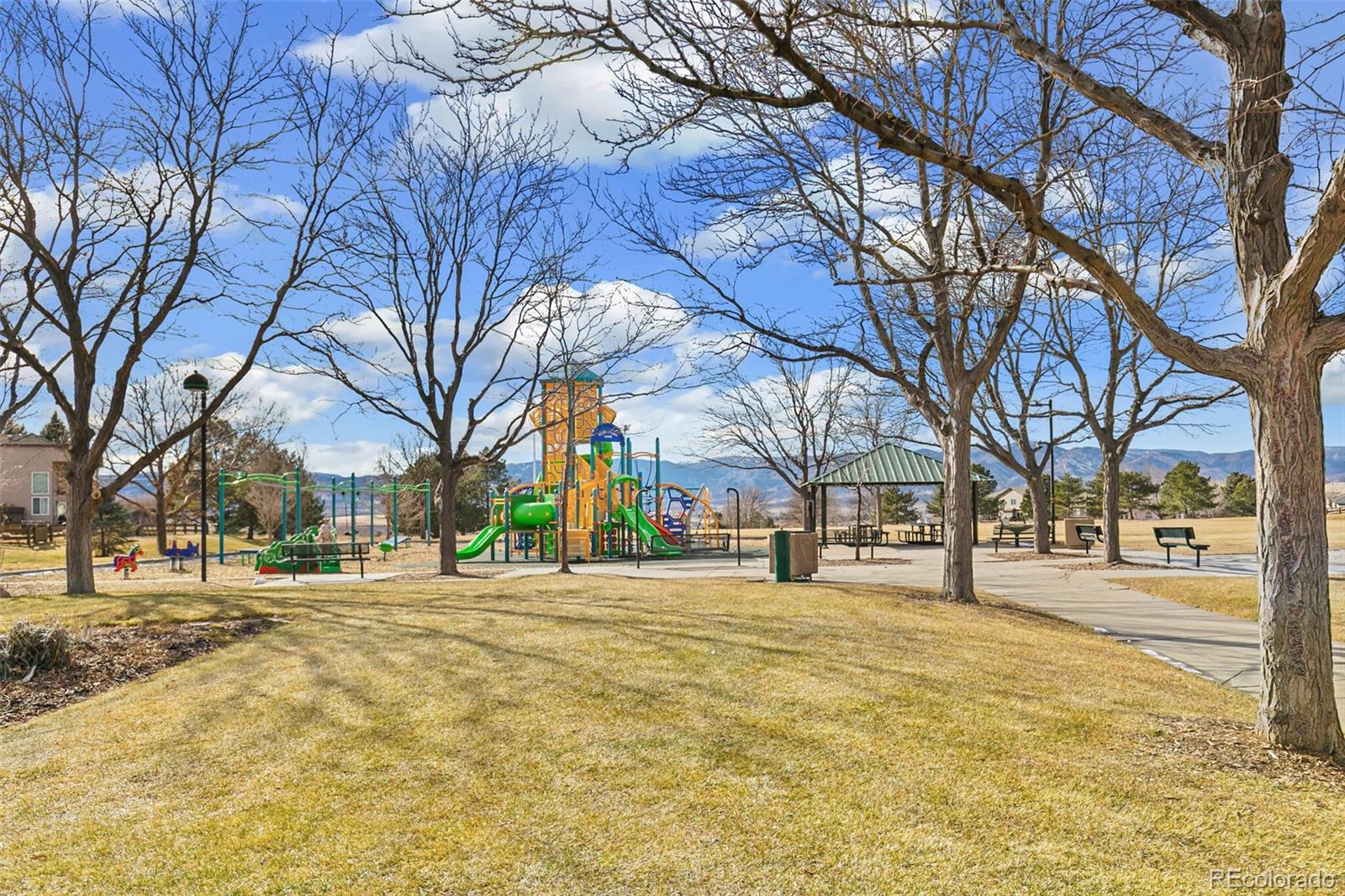 10275 Baneberry Place Highlands Ranch, CO 80129 - Photo 49 of 50 a building with trees in front of it
