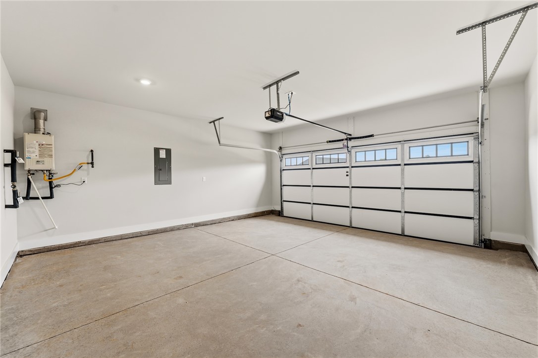 310 Bluestem Court Anderson, SC 29621 - Photo 33 of 36 This spacious garage features a large overhead door and ample room for vehicles or storage.
