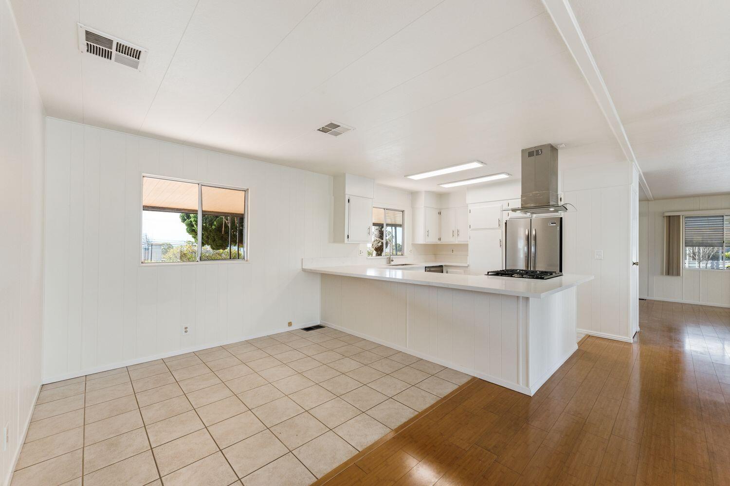 6180 Via Real, Unit 118 Carpinteria, CA 93013 - Photo 12 of 37 a view of kitchen with center island and stainless steel appliances