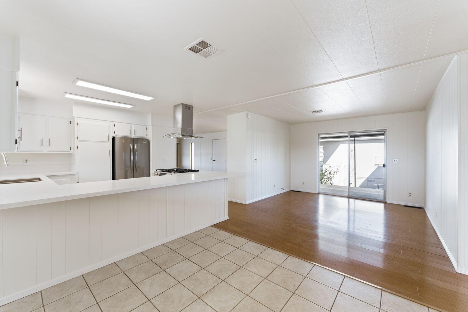 6180 Via Real, Unit 118 Carpinteria, CA 93013 - Photo 14 of 37 a view of a kitchen with wooden floor and a sink